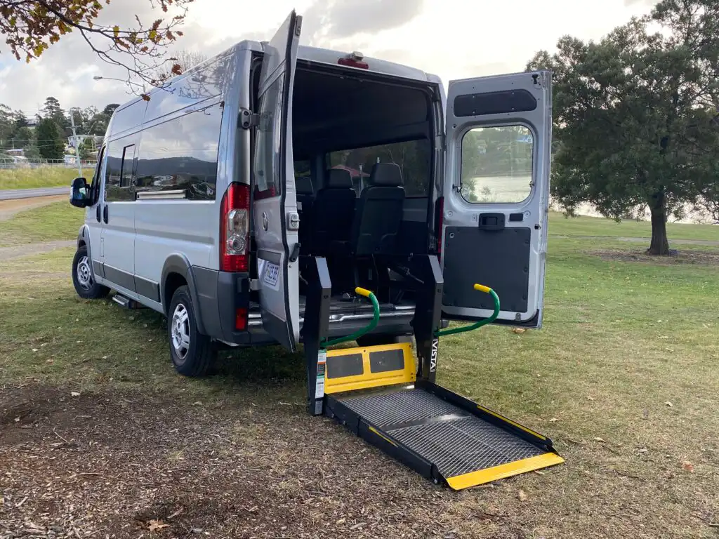 Wheelchair lift accessible coach